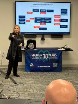 Photo showing Pat McGrew giving a presentation during the RevSpring CAC Meeting