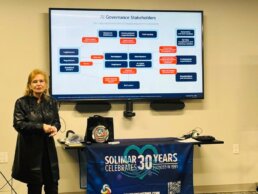 Photo showing Pat McGrew giving a presentation on AI during the RevSpring CAC Meeting